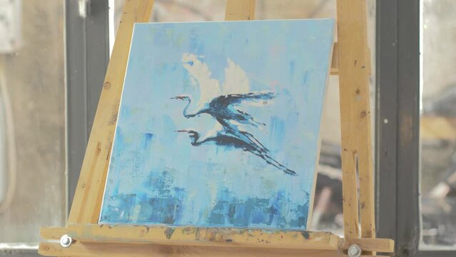 Completed acrylic painting of Herns in art studio