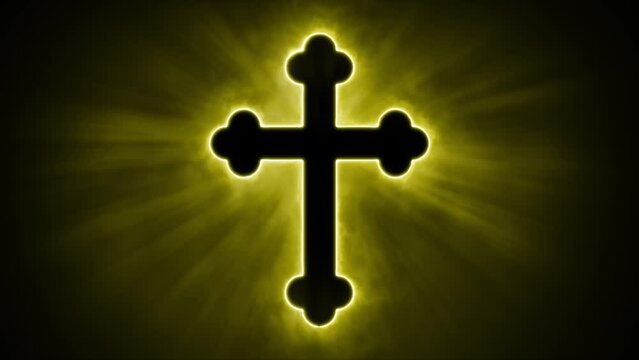 Uplifting and deeply inspiring reveal animation of an ornate and holy golden Christian crucifix cross, in a smoky mystical glow and emating shining God rays and light beams, on a black background