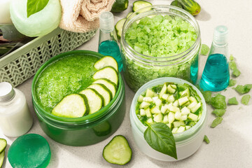 Homemade cosmetics with cucumber. Natural cream, sea salt, body lotion, and soap