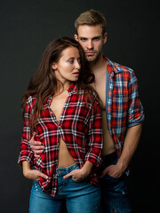 sexy man and woman standing together in checkered shirt, love