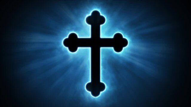 Uplifting and deeply inspiring reveal animation of an ornate and holy blue Christian crucifix cross, in a smoky mystical glow and emating shining God rays and light beams, on a black background