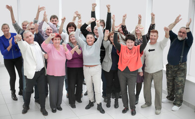 Fototapeta premium Large group of happy people applauding thier team victory