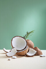 Top view of coconut decorated in pink background 