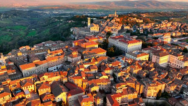 aerial view of Perugia at sunset, flying over the town of Perugia, the capital of Umbria, Tuscany in Italy, Italian medieval town, tourist destination in Italy