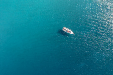 Small yacht at sea, top view