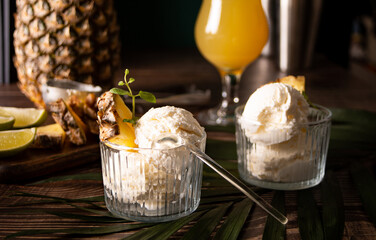 Delicious pineapple ice cream sorbet sundae. Summer food concept.