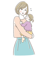泣く子供を抱っこしている母親