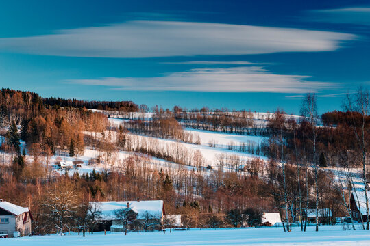 Snow-covered countryside in Jizery Mountains at sunset, Zlata Olesnice, Liberec Region, Czech Republic (Czechia)
