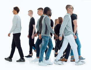 in full growth. diverse young people walk past each other