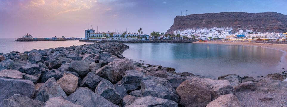 View of Puerto de Mogan beach and town at sunset, Playa de Puerto Rico, Gran Canaria, Canary Islands