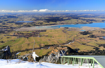 A Panorama view of a winter landscape from Tegelberg mountain near Füssen, Bavaria, Germany, Europe.