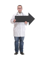 Front view of young smiling doctor holding a black arrow pointing right