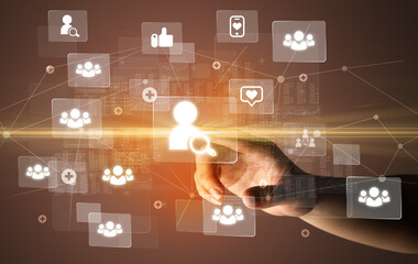 Hand pressing social media multimedia application screen with media icons on futuristic concept