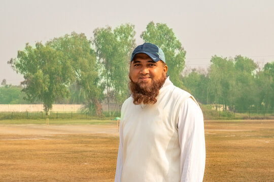 cricket player smiling on match ground - Powered by Adobe