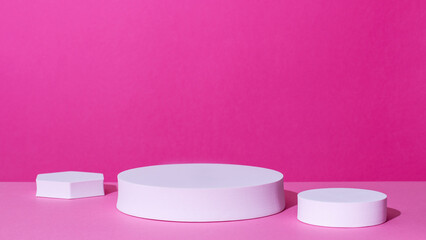 Empty podium or stand for product showcase on pink background