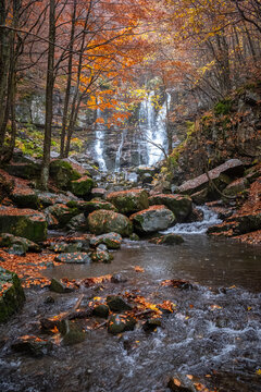 Dardagna waterfalls and river with autumn foliage, Emilia Romagna