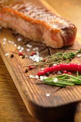 Grilled ribeye beef steak, herbs and spices