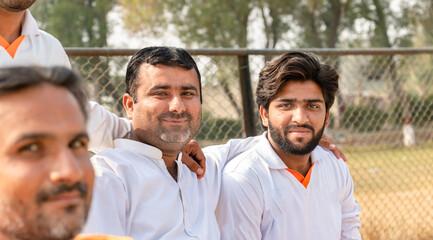 cricket players looking into the camera on match ground