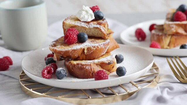French cinnamon toast with blueberries, raspberries, sugar and coffee. Morning breakfast. French breakfast. 