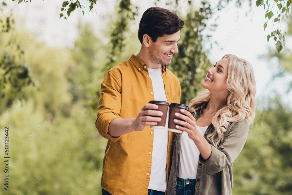 Poster portrait of beautiful handsome friendly cheerful couple meeting spending free time drinking cappucci