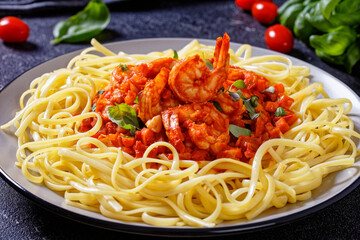 shrimps in tomato sauce with pasta, top view