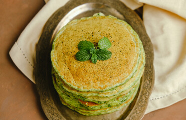 Heap of green spinach pancakes.