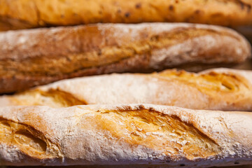 Several French baguette breads, close-up.