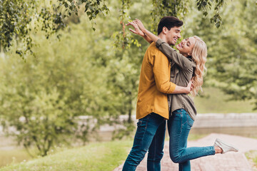 Profile side view portrait of attractive affectionate dreamy cheerful couple cuddling meeting...