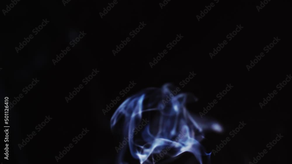 Poster abstract blue color smoke with a black background in slow motion. realistic cloud smoke with a strea
