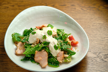Grilled spicy lamb and salad wrapped in flatbread, with tomatoes