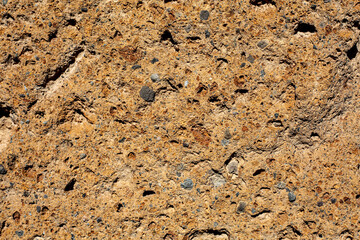 Background volcanic tuff bricks for exterior and interior wall. Old stone wall.Close up.