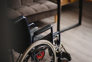 Modern Empty Wheelchair stand in Room.