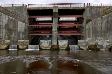 Old soviet river dam in spring
