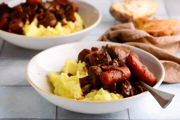 Mushroom stew with cheese in a white pan.style rustic