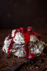 Meringue cake with chocolate and cherries