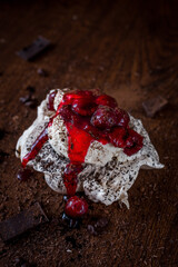 Meringue cake with chocolate and cherries