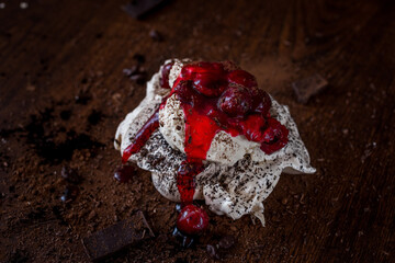 Meringue cake with chocolate and cherries