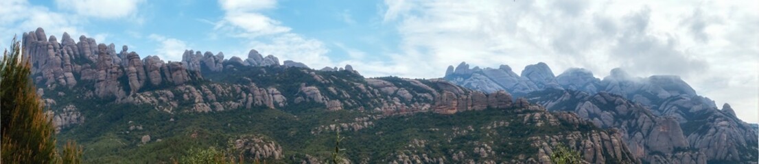 Fototapeta na wymiar Panoramic view of the Montserrat Gorge. Monestir Santa Maria de Montserrat.