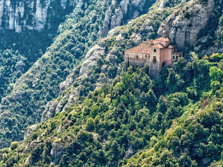 Fototapeta na wymiar Montserrat is a mountain near Barcelona, in Catalonia. View of the chapel of Santa Cova