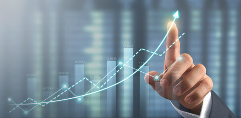 Hand touching  graphs of financial indicator market analysis chart