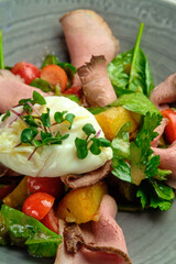 Grilled spicy lamb and salad wrapped in flatbread, with tomatoes