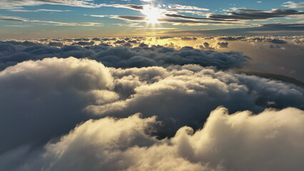 Top view of the clouds in the morning light. Aerial view of cumulus clouds.