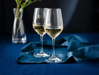 Two Glasses of White Wine on Blue