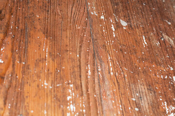 Texture of lacquered wooden surface with white paint splashes and blur