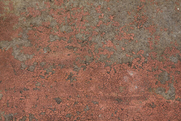 Texture of cracked peeling brown red paint