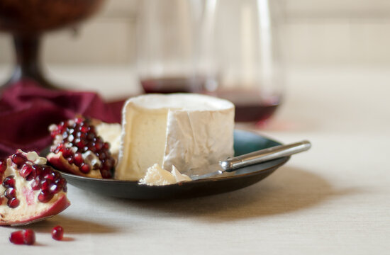 Brie with Pomegranate; Some Brie on a Knife
