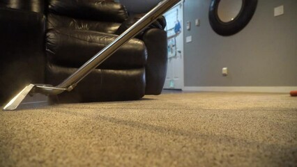 Cleaning a carpet in a big house. Professional cleaning service.