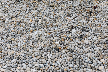 We can see a lot of stones on the beach.