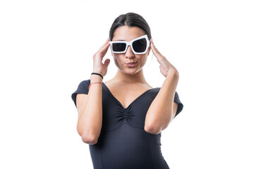 Obraz premium Studio portrait of young brunette model woman wearing funny fancy white sun glasses making faces