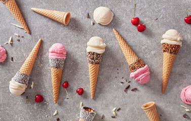 Fototapeta na wymiar Vanilla and cheery ice cream cones